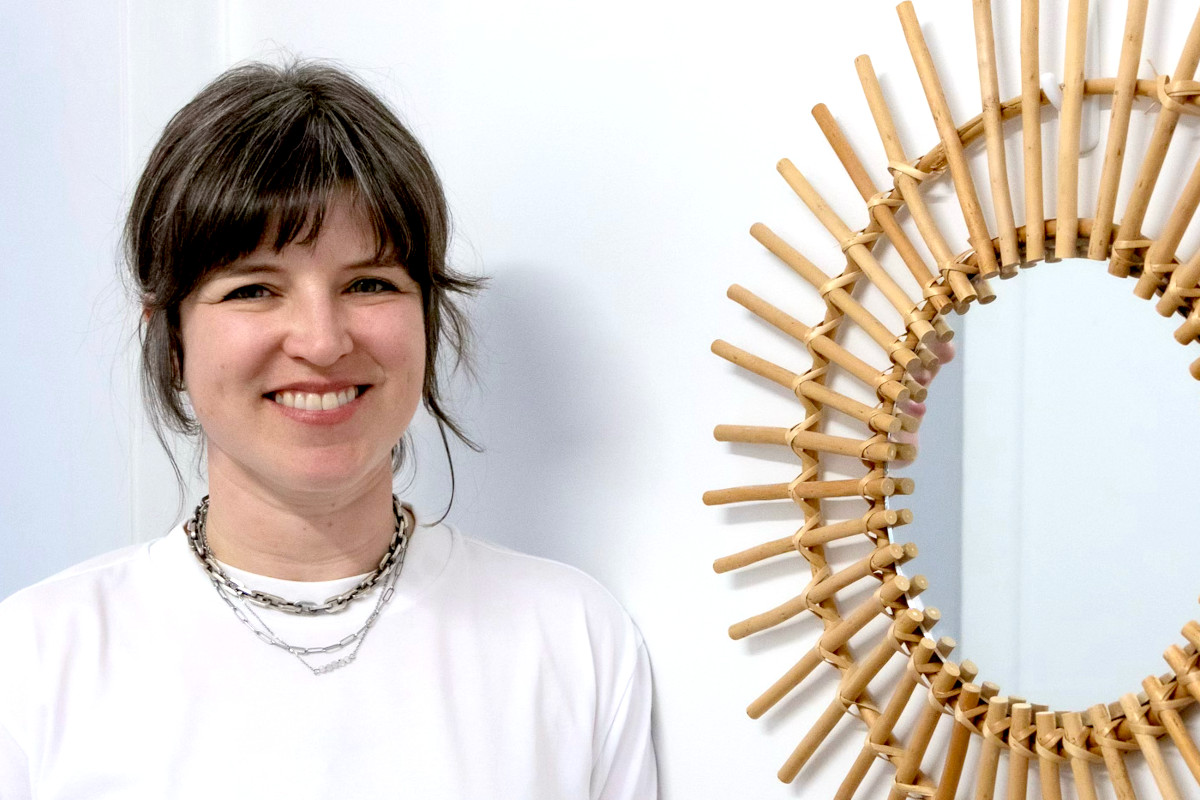 A person sitting at a desk in front of a computer